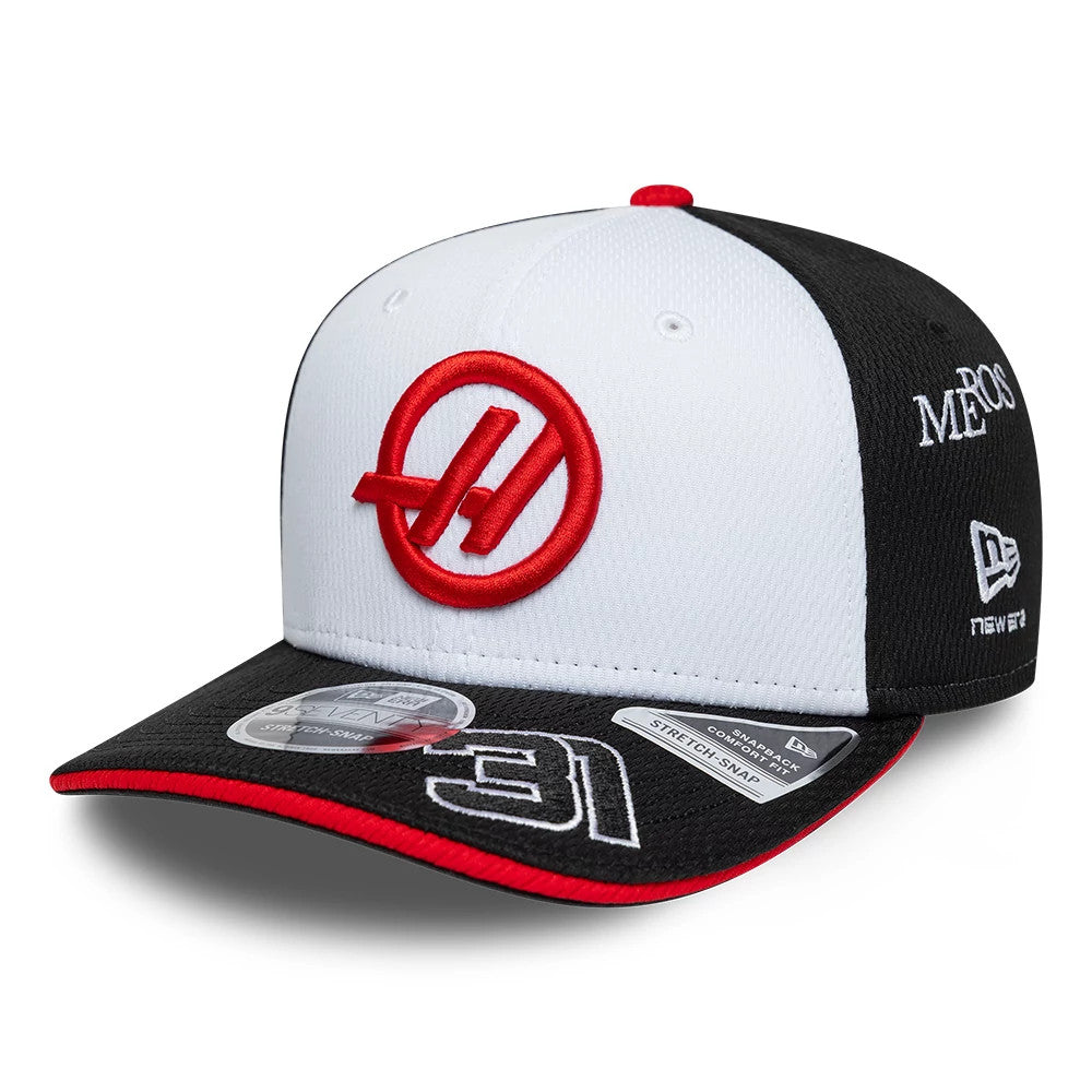 TGR Haas F1 Esteban Ocon Black New Era 9SEVENTY Stretch Snap Adjustable Cap, front view showing the red raised team logo embroidered on the white front panel, with a contrasting black visor featuring a white 31 outline and a size sticker.