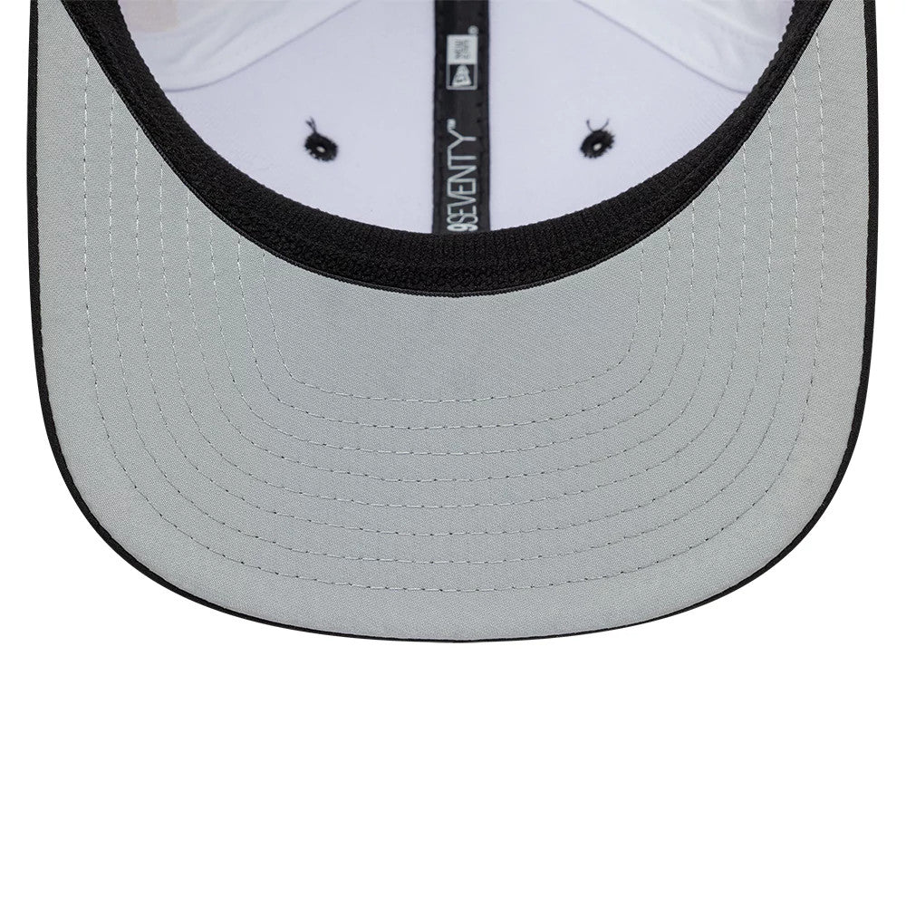 TGR Haas F1 Miami Race Special White New Era 9SEVENTY Stretch Snap Cap, inside view showing a grey undervisor with detailed stitching, a black interior sweatband, and white taping featuring the New Era logo in the centre.