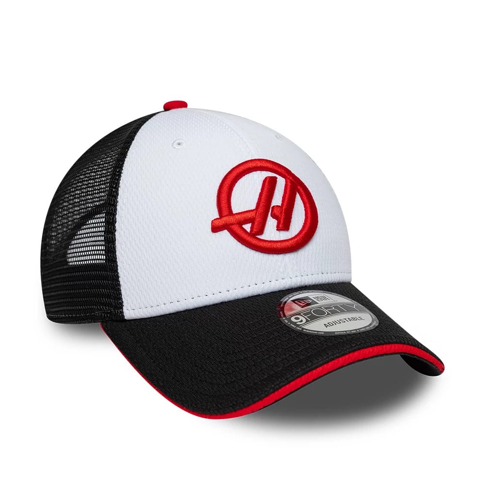 TGR Haas F1 Summer League Black New Era 9FORTY Adjustable Cap, three-quarter view with a prominent red embroidered Haas logo on the white front panel, black mesh side panels, black curved visor with red underneath, and a 9FORTY size sticker.