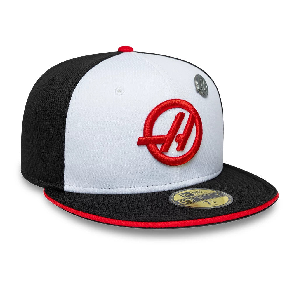 TGR Haas F1 Summer League Black New Era 59FIFTY Fitted Cap, three-quarter view showing a red embroidered logo on the front white panel, a black visor with a red edge, and a gold 59FIFTY size sticker on the top of the visor.