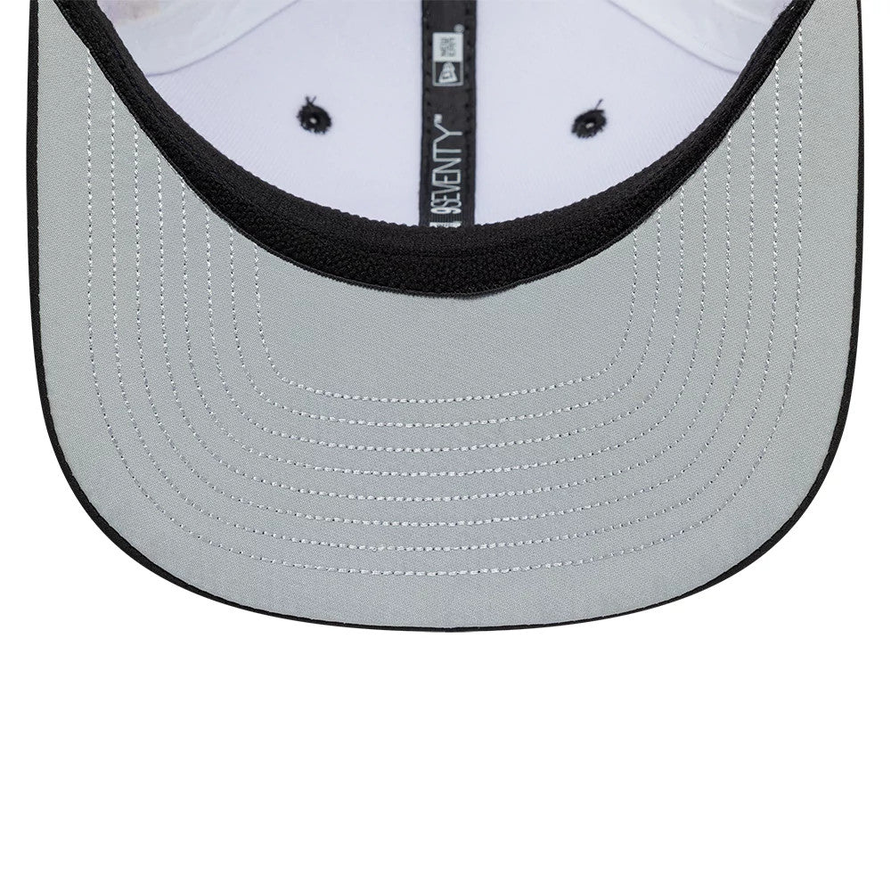TGR Haas F1 Esteban Ocon Miami Race Special White New Era 9SEVENTY Stretch Snap Cap, inside view showing the black taped seam with white 9SEVENTY lettering, a grey undervisor with detailed stitching, and a white sweatband around the crown.