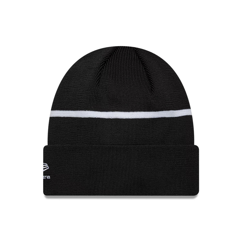 New Era TGR Haas F1 Team Black Cuff Knit Beanie Hat, front view showing a black knit design with a white horizontal stripe across the middle and the white embroidered New Era flag logo on the left side of the cuffed visor.