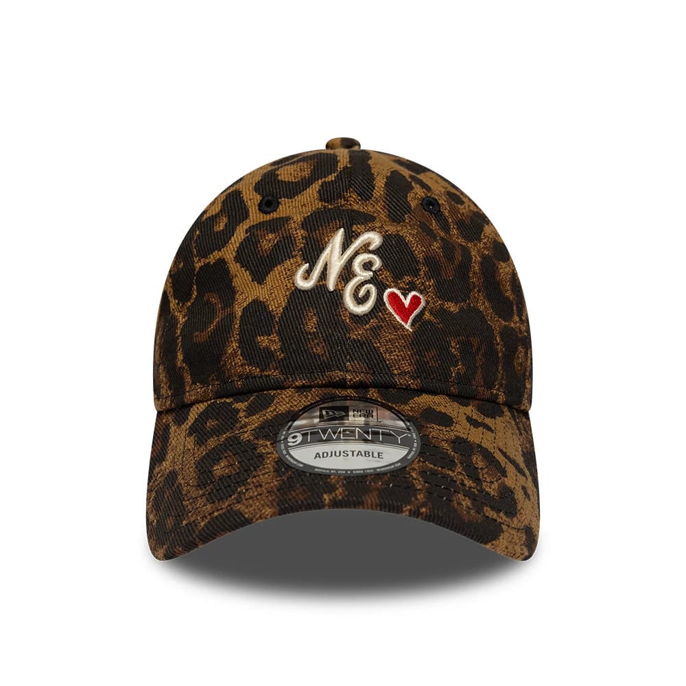 New Era Leopard Heart Brown 9TWENTY Adjustable Cap, front view showing the cream embroidered NE logo with a red heart on the leopard print front panel, curved visor and 9TWENTY size sticker centred on the brown leopard-print visor.