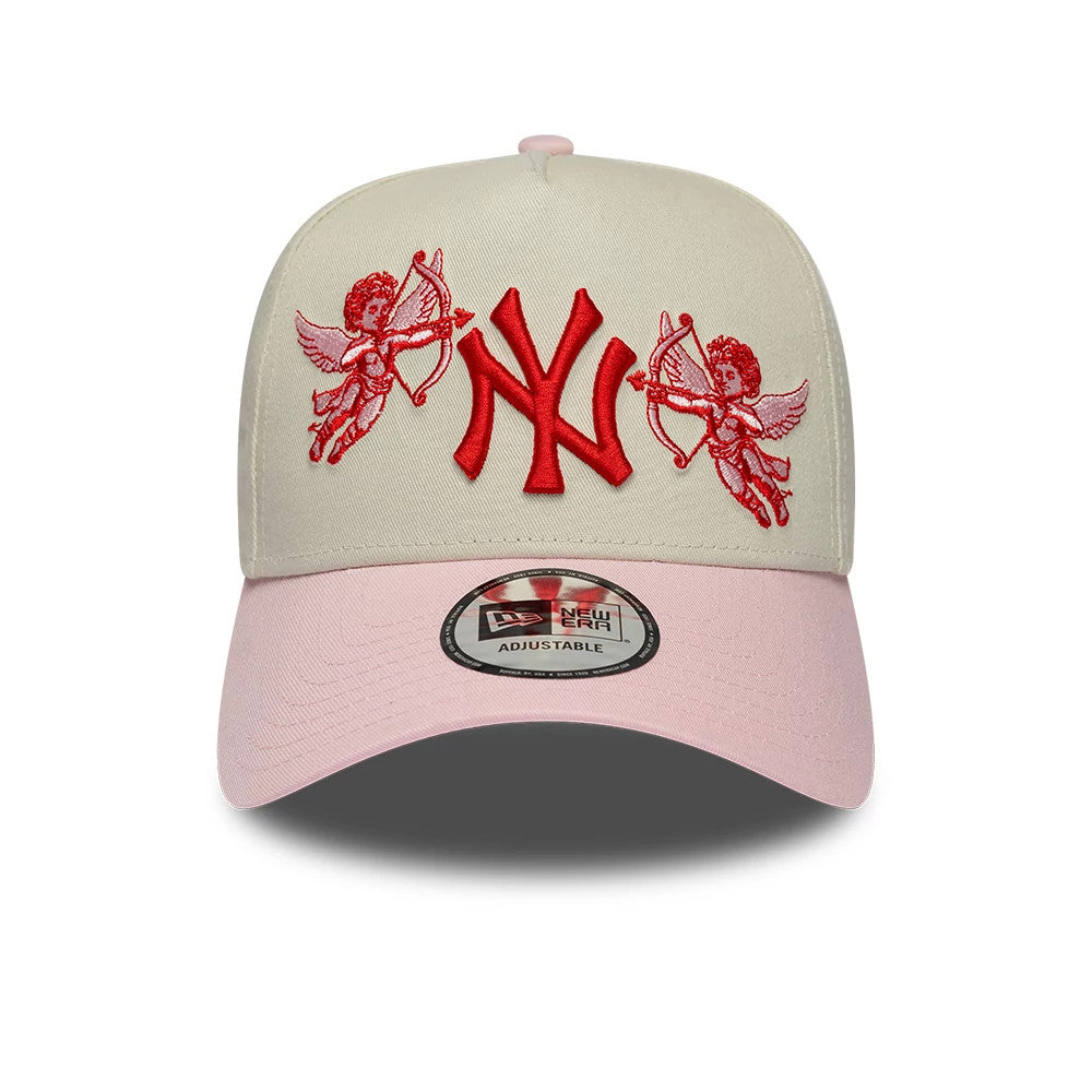 New York Yankees MLB Cherub Cream & Pink New Era 9FORTY A-Frame Adjustable Cap, front view showing a red embroidered NY logo flanked by two cherubs on the cream front panels, with a pink curved visor and a 9FORTY size sticker.