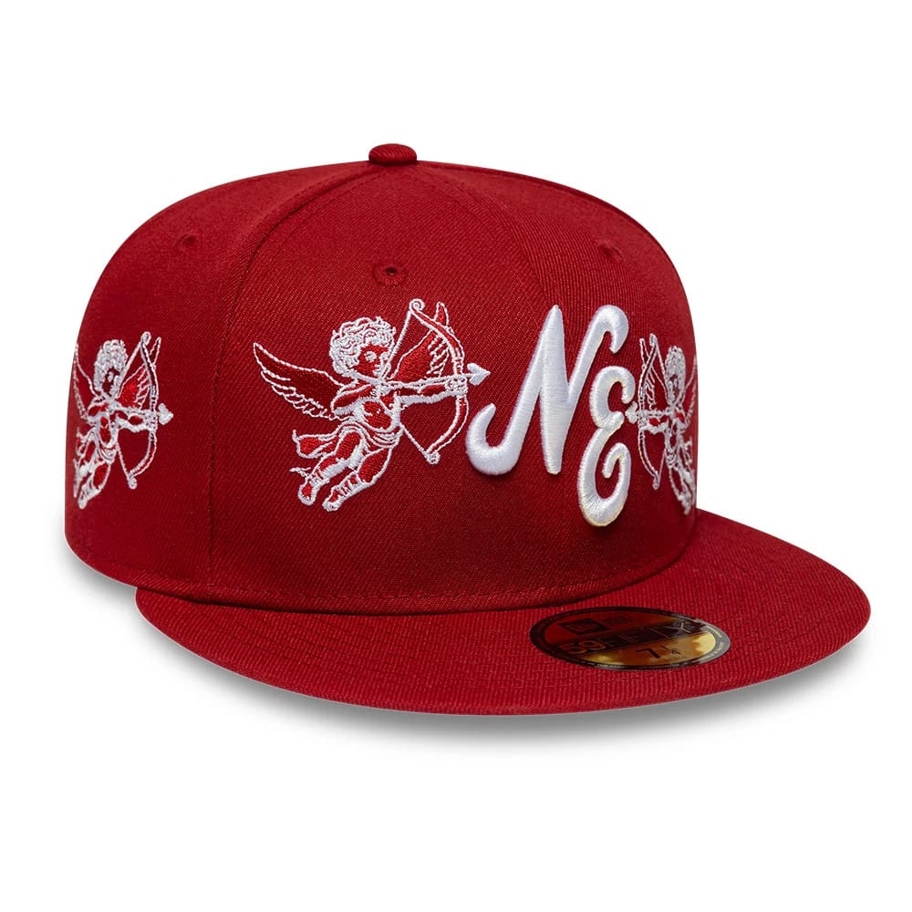 New Era Cherub Dark Red 59FIFTY Fitted Cap, front view showing white embroidered cherub designs across the front panels, a raised white NE logo in the centre, and a gold 59FIFTY size sticker on the flat red visor.
