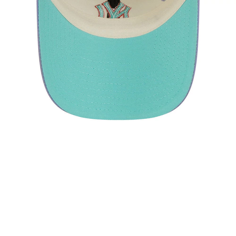 New Era New York Yankees MLB Lavender Flowers White Casual Classic Adjustable Cap, inside view showing the teal undervisor with detailed stitching, cream sweatband, and multi-coloured embroidered Yankees logo on the front curved structure.