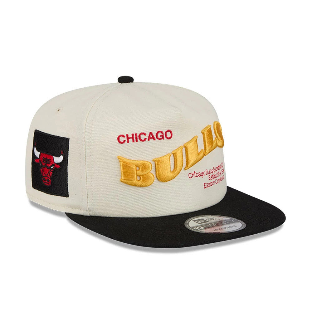 Chicago Bulls NBA Conference Script White New Era 19TWENTY Adjustable Cap, three-quarter view showing the large yellow Bulls embroidery with smaller red Chicago words on the front panel, black embroidered Bulls logo on the left side.