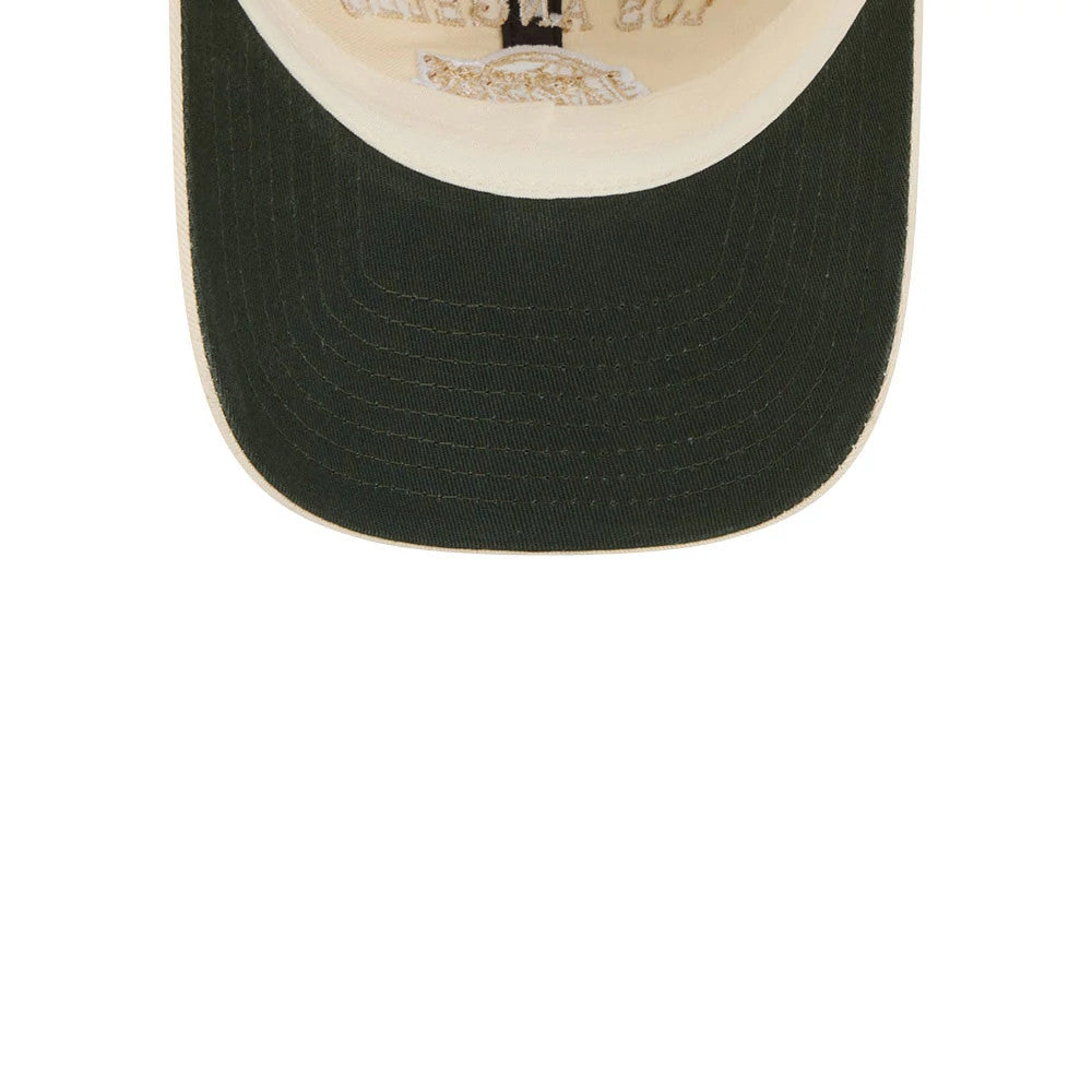 New Era LA Lakers NBA Team Logo White Casual Classic Adjustable Cap, inside view showing the dark green undervisor, cream sweatband, and inner stitching detail, with branding printed on the interior panel above the brow area.