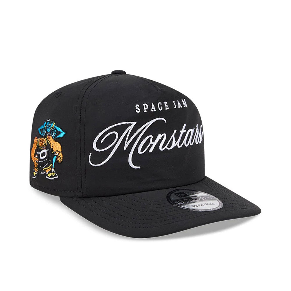 Space Jam Monstars Black New Era 19TWENTY Adjustable Cap, front view showing raised white embroidered Monstars lettering on the front panel, with a colourful character graphic on the left side and a 19TWENTY size sticker on the black visor.