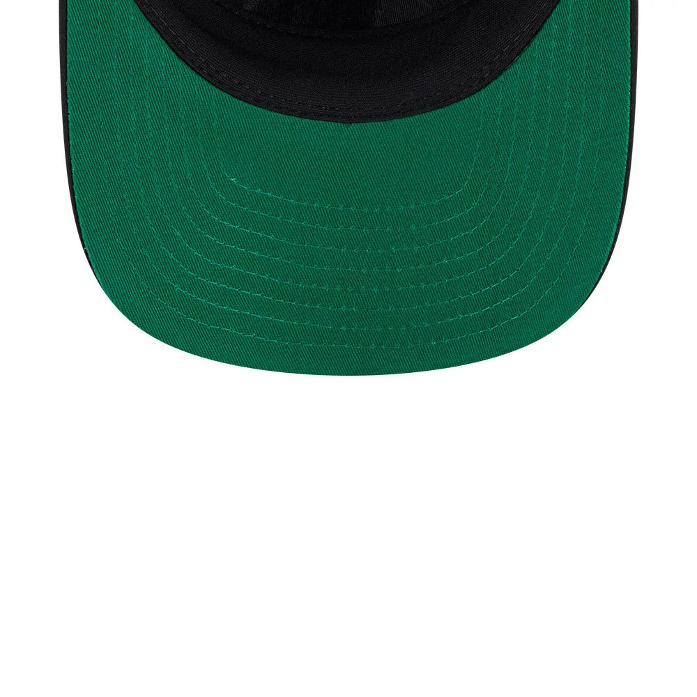 Space Jam Monstars Black New Era 19TWENTY Adjustable Cap, inside view showing the contrasting green undervisor, black sweatband, and interior seams with neat stitching detail, highlighting the underside craftsmanship of the cap.