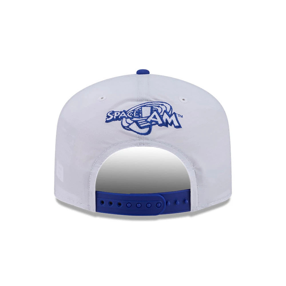 Space Jam Tune Squad White New Era 19TWENTY Adjustable Cap, rear view showing the embroidered blue Space Jam logo centred on the white panels, with a contrasting blue adjustable strap and matching blue top button.
