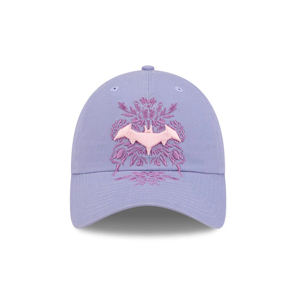 Womens DC Batgirl Pastel Purple New Era Casual Classic Adjustable Cap, front view showing a pink Batgirl logo in raised embroidery on the purple front panel, complemented by intricate purple floral beneath and around the logo.
