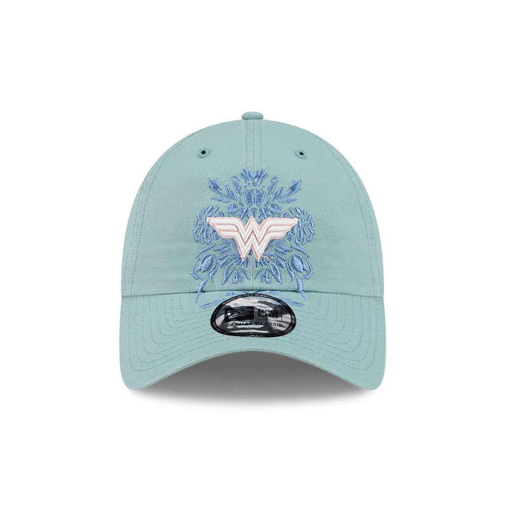 New Era Womens DC Wonder Woman Pastel Blue Casual Classic Adjustable Cap, front view showing the raised pink and white Wonder Woman logo embroidered on the structured pastel blue crown, with intricate blue floral.