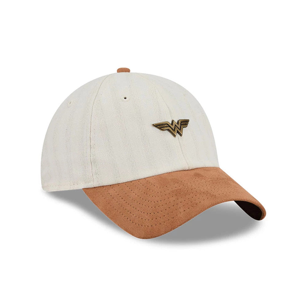 New Era Womens DC Wonder Woman White Casual Classic Adjustable Cap, three-quarter view showing the gold Wonder Woman logo on the front panel, paired with a brown curved visor and a matching top button on the white crown.