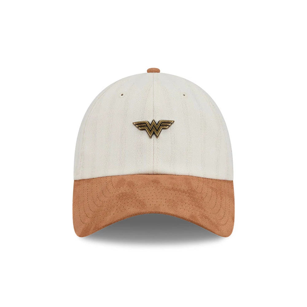 New Era Womens DC Wonder Woman White Casual Classic Adjustable Cap, front view showing a gold raised embroidered Wonder Woman logo on the centre of the white crown, with a contrasting light brown suede visor and matching top button.