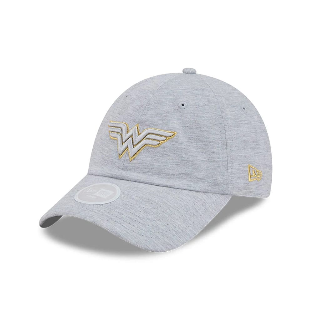 Womens DC Wonder Woman Grey New Era Open Back Cap, three-quarter view showing the gold Wonder Woman logo embroidered on the front panel, a curved grey visor with a 9FORTY size sticker, and the New Era flag logo on the left side.