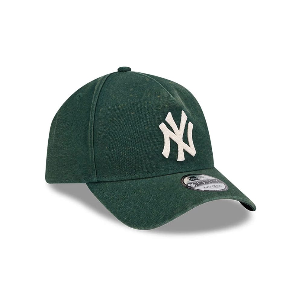 Yankees MLB Washed Canvas Dark Green New Era 9FORTY A-Frame Adjustable Cap, three-quarter view showing the raised white NY logo embroidered on the front panel, with a curved dark green visor and the 9FORTY size sticker on the top.