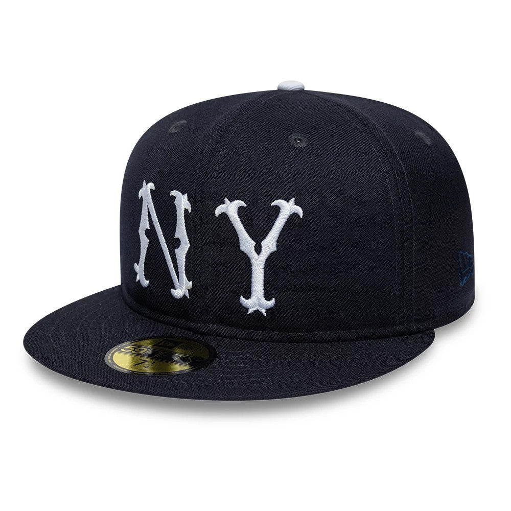 New York Highlanders MLB Cooperstown Navy New Era 59FIFTY Fitted Cap, three-quarter view showing the raised white NY embroidery on the front panel, a navy flat visor with a gold 59FIFTY size sticker, and the New Era flag logo on the left side.