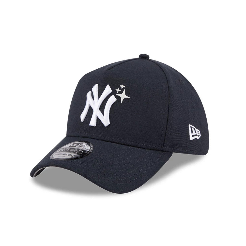 Yankees MLB Glow Stars Navy New Era 39THIRTY A-Frame Stretch Fit Cap, three-quarter view showing a raised white NY logo with glow stars on the front panel, a navy curved visor with a 39THIRTY size sticker, and the New Era flag logo on the left side.