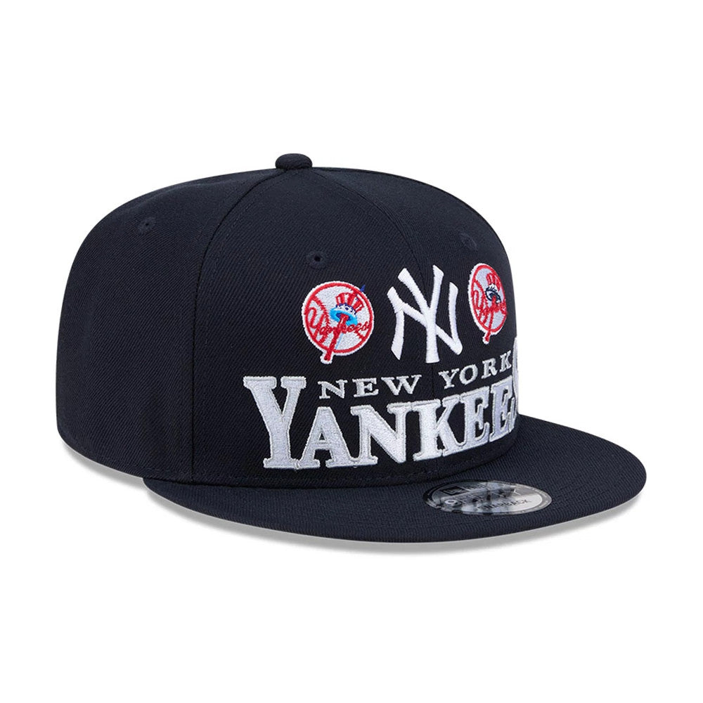 Yankees MLB Cooperstown Throwback Navy New Era 9FIFTY Snapback Adjustable Cap, front view showing raised white NY and New York Yankees embroidery with two red team logos on the navy structured crown, and a 9FIFTY size sticker on the flat visor.