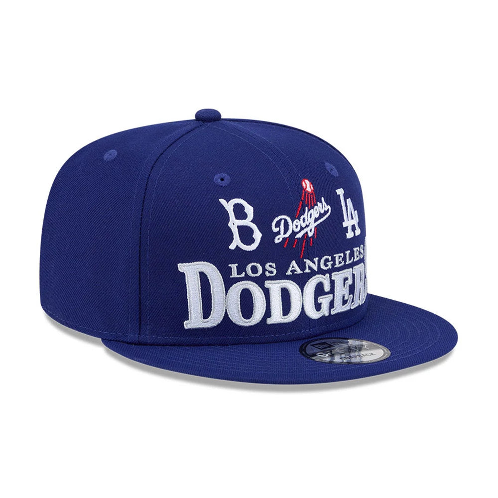 LA Dodgers MLB Cooperstown Throwback Blue New Era 9FIFTY Snapback Adjustable Cap, three-quarter view with raised white embroidered lettering on the front panel, Dodgers script and logo in red and white.