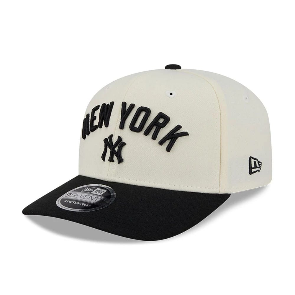 Yankees MLB 2 Tone Cream & Black New Era 9SEVENTY Stretch Snap Adjustable Cap, front view showing raised black New York lettering and NY logo embroidered on the cream front panels, with a contrasting black visor and 9SEVENTY size sticker.