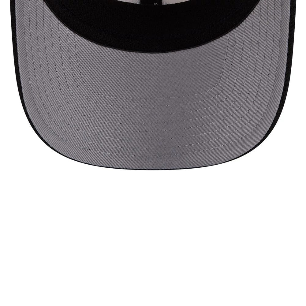 Yankees MLB 2 Tone Cream & Black New Era 9SEVENTY Stretch Snap Adjustable Cap, inside view showing the grey undervisor, black sweatband, and black interior taping, highlighting its detailed stitching.