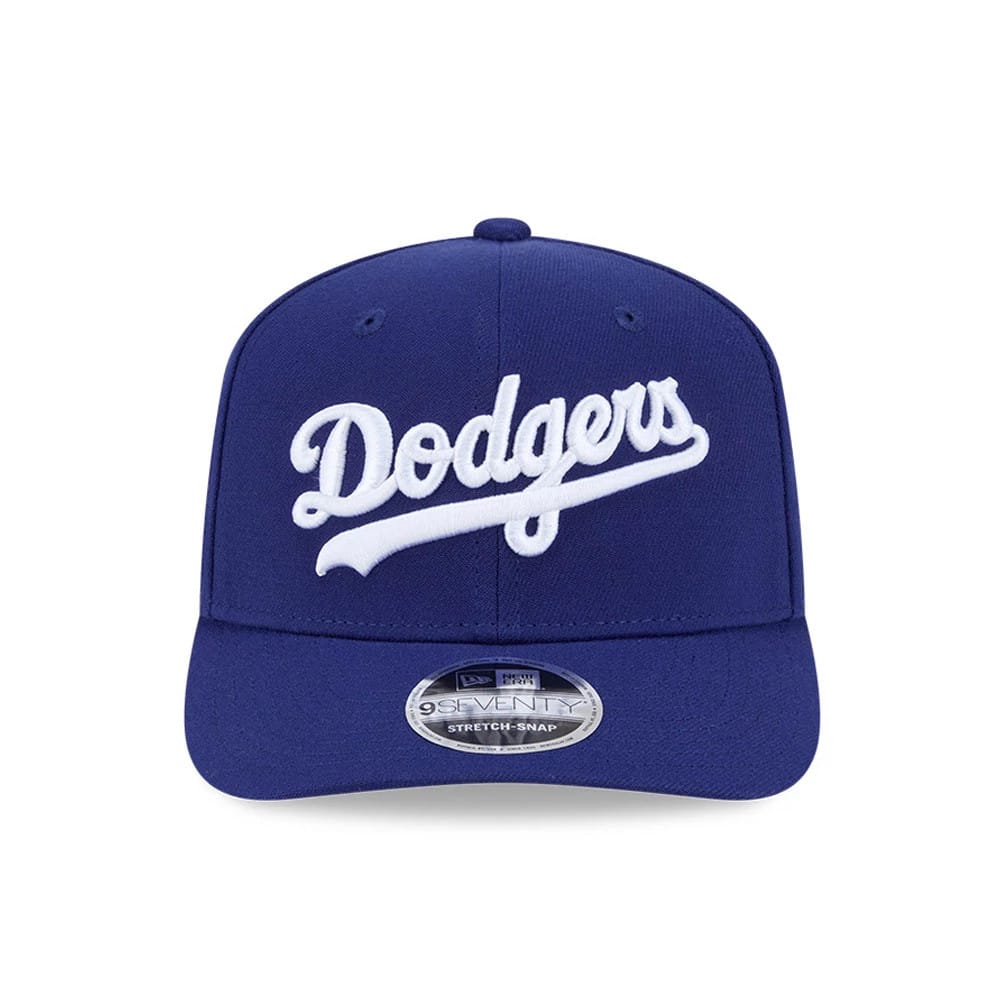 LA Dodgers MLB Dark Blue New Era 9SEVENTY Stretch Snap Adjustable Cap, front view showing the white embroidered Dodgers script logo on the structured dark blue crown, complemented by a slightly curved visor and 9SEVENTY size sticker.