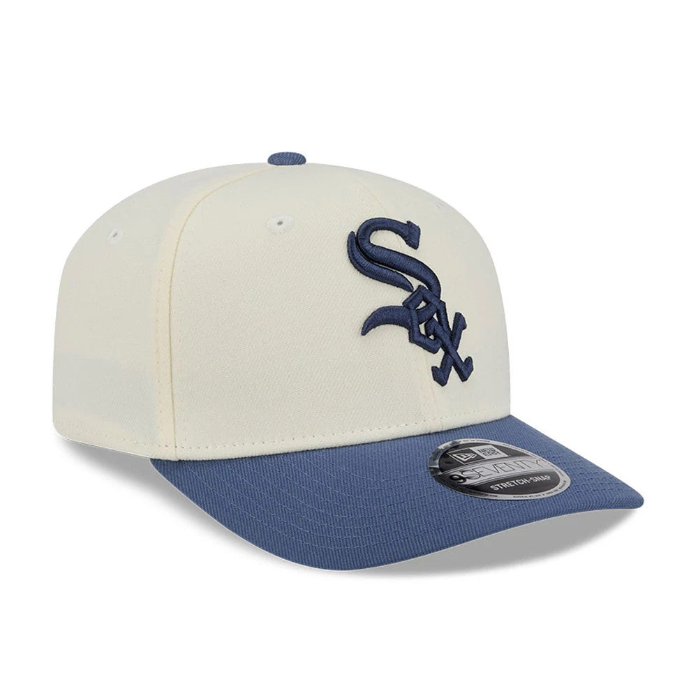 White Sox MLB Slate Stone Cream & Dark Blue New Era 9SEVENTY Stretch Snap Adjustable Cap, front three-quarter view showing raised dark blue embroidered Sox logo on cream front panels, with dark blue visor and 9SEVENTY size sticker.