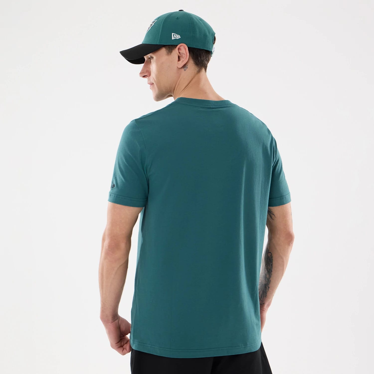 The model is wearing this NFL Training 2026 Philadelphia Eagles T-Shirt in dark green. 2