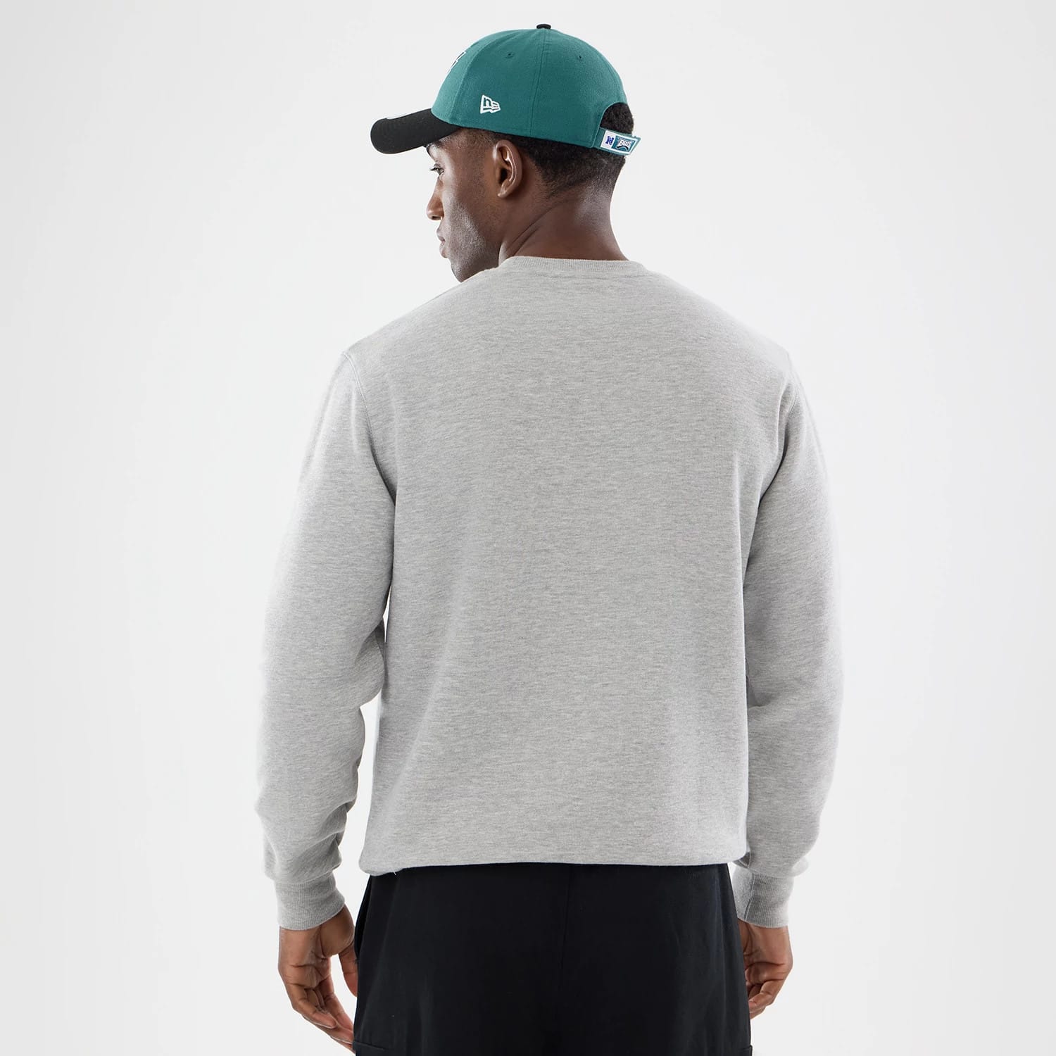 The model is wearing this NFL Training 2026 Philadelphia Eagles Crew Neck Sweater in grey. 2