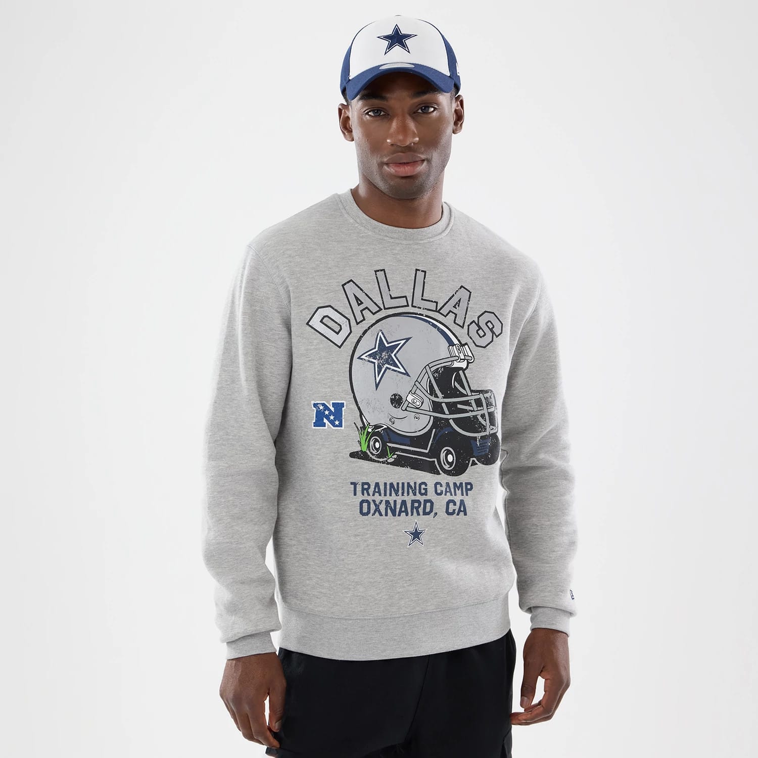 The model is wearing this NFL Training 2026 Dallas Cowboys Crew Neck Sweater in grey. 1