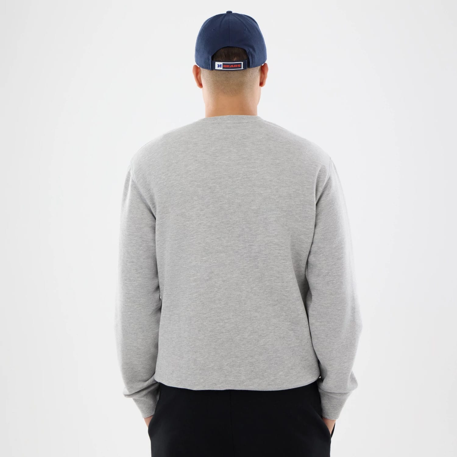The model is wearing this NFL Training 2026 Chicago Bears Crew Neck Sweater in grey. 2