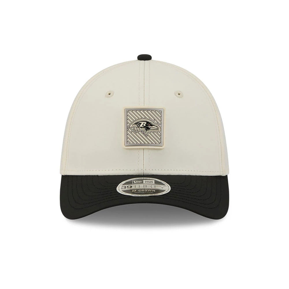 Baltimore Ravens NFL Training 2026 White New Era 39THIRTY M-Crown Stretch Fit Cap, front view showing the Ravens logo plate on the white crown, black curved visor with 39THIRTY size sticker, and black top button.