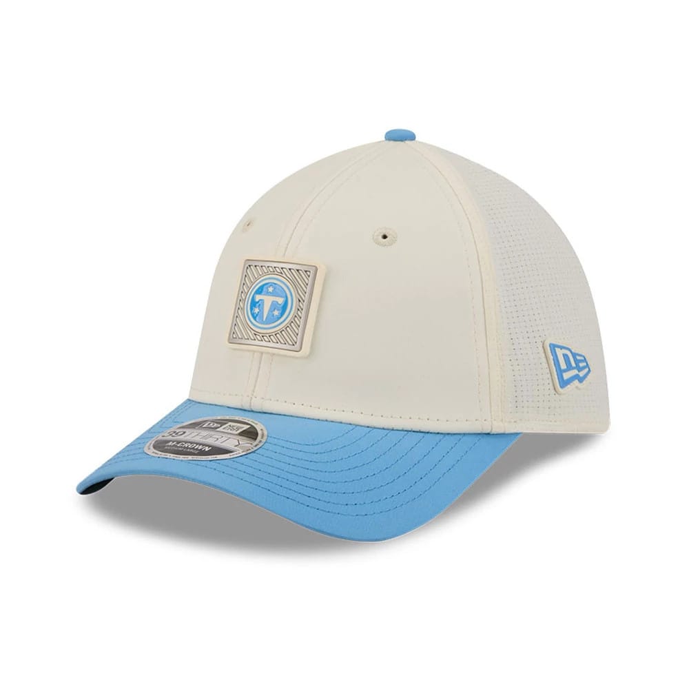 Tennessee Titans NFL Training 2026 White New Era 39THIRTY M-Crown Stretch Fit Cap, front view showing a Titans logo patch on the cream front panel, light blue curved visor with 39THIRTY size sticker, and embroidered New Era flag on the left side.