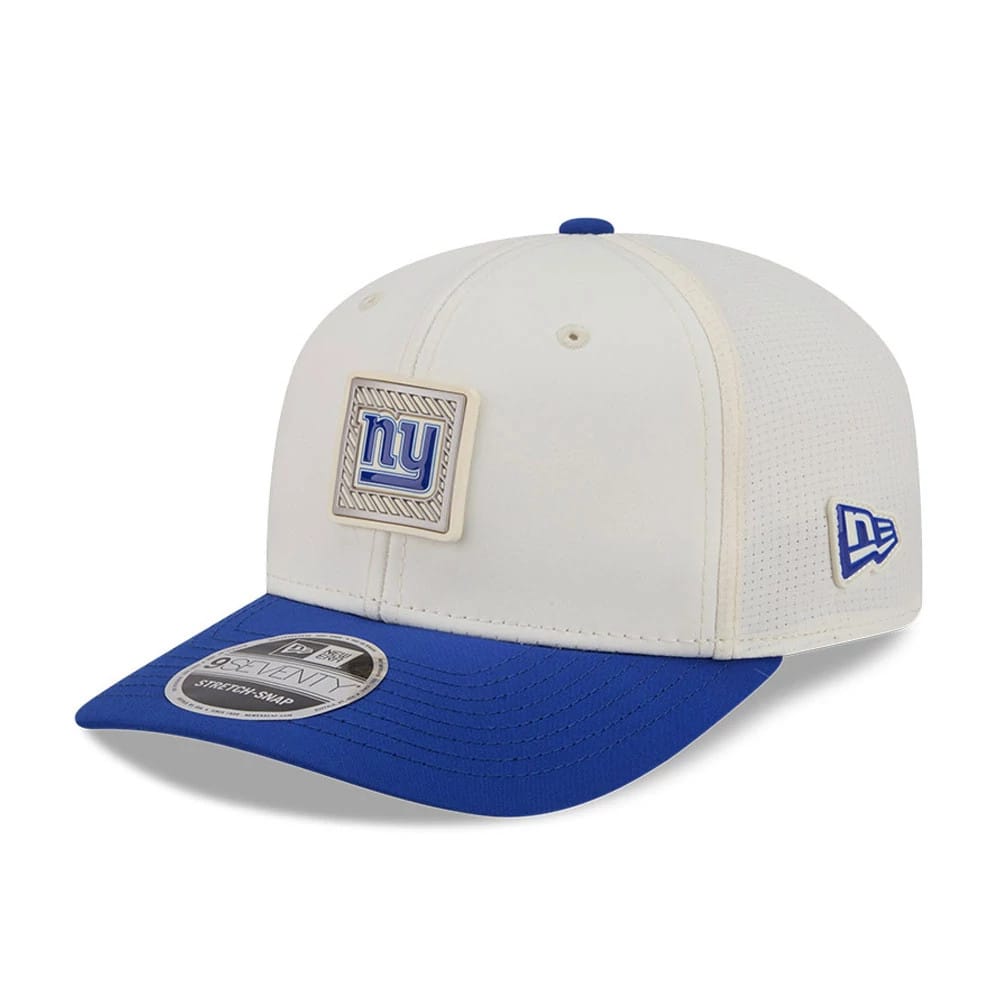 New York Giants NFL Training 2026 White New Era 9SEVENTY Stretch Snap Adjustable Cap, three-quarter view showing raised blue and white Giants logo on the front panel, blue curved visor with 9SEVENTY size sticker.