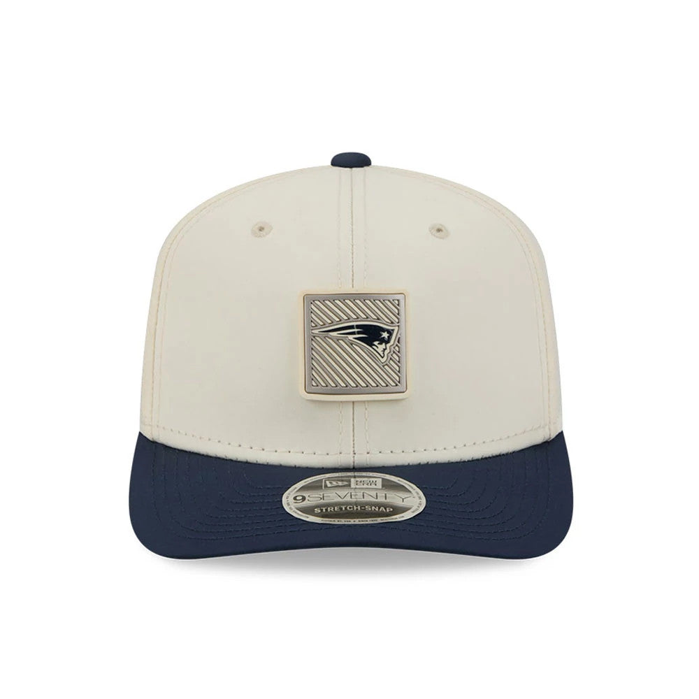 Patriots NFL Training 2026 White New Era 9SEVENTY Stretch Snap Adjustable Cap, front view showing a large square Patriots logo patch on the structured white crown, with a contrast navy visor and a 9SEVENTY size sticker on the curved visor.
