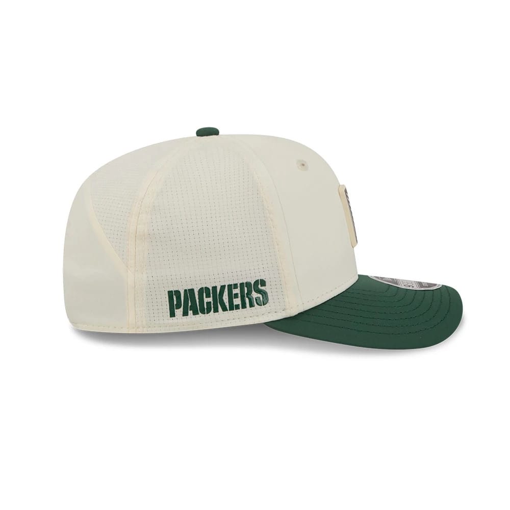 Packers NFL Training 2026 White New Era 9SEVENTY Stretch Snap Adjustable Cap, side view showing the green embroidered Packers lettering on the white mesh back panel, complemented by the green curved visor and white top button.