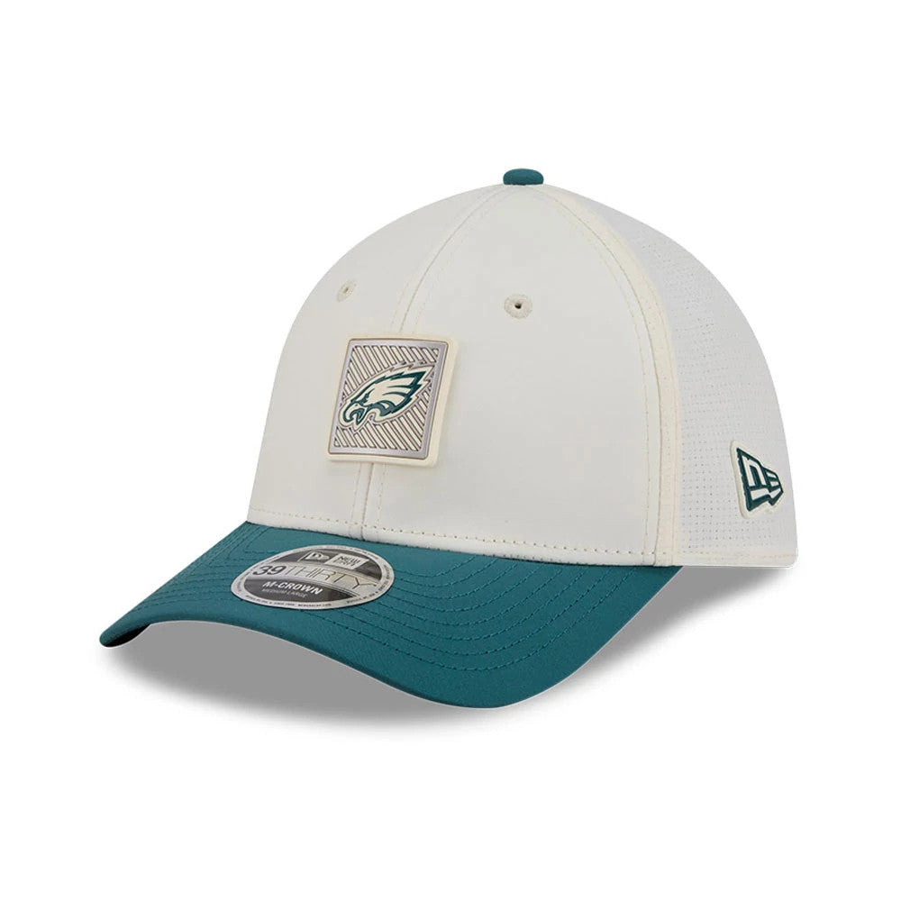 Eagles NFL Training 2026 White New Era 39THIRTY M-Crown Stretch Fit Cap, three-quarter view showing the front patch with the Eagles logo and radiating design, a teal curved visor with the 39THIRTY size sticker, and New Era flag on the left side.