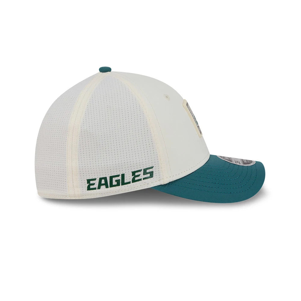 Eagles NFL Training 2026 White New Era 39THIRTY M-Crown Stretch Fit Cap, side view showing the dark green embroidered Eagles text on the white fabric, with a contrasting curved teal visor and a 39THIRTY size sticker.