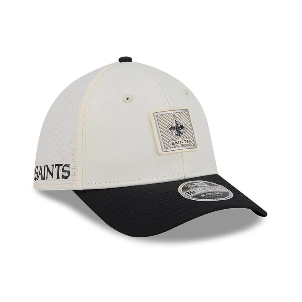 New Orleans Saints NFL Training 2026 White New Era 39THIRTY M-Crown Stretch Fit Cap, three-quarter view showing a raised team logo patch on the front panel, embroidered SAINTS text on the side, and a black curved visor with a 39THIRTY size sticker.