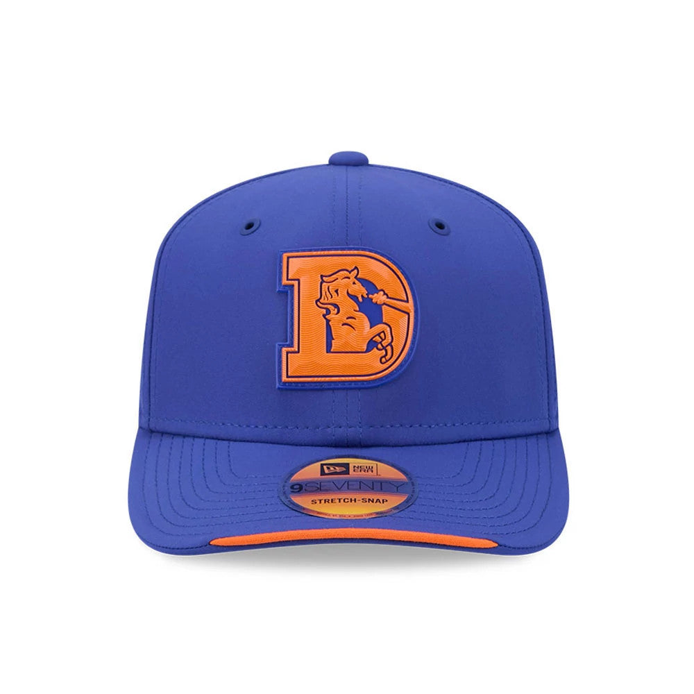 Broncos NFL Sideline 2026 Blue New Era 9SEVENTY Stretch Snap Adjustable Cap, front view showing the raised orange embroidered D logo with a horse head on the front panel, complemented by a curved blue visor and 9SEVENTY size sticker.