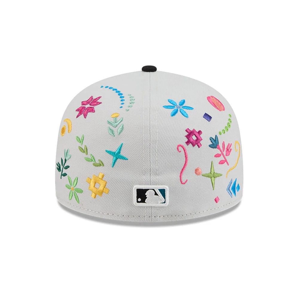 Chicago White Sox MLB Heritage Light Beige New Era 59FIFTY Fitted Cap, rear view showing the white embroidered MLB Batterman logo at the centre of the back panels, surrounded by multicoloured floral.