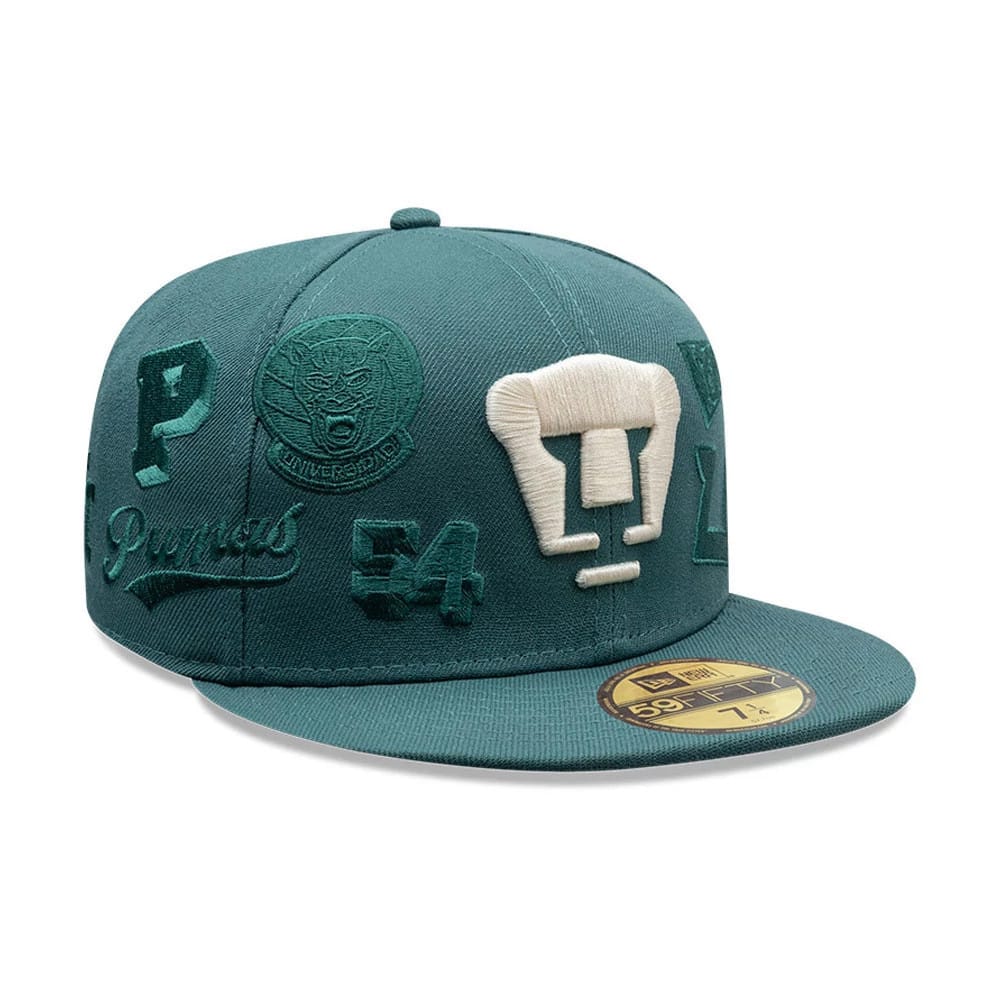 Pumas Unam Liga MX All Over Dark Green New Era 59FIFTY Fitted Cap, front view showing a white embroidered Pumas logo on the front panel, with various green embroidered graphics on either side and a gold 59FIFTY size sticker on the flat visor.