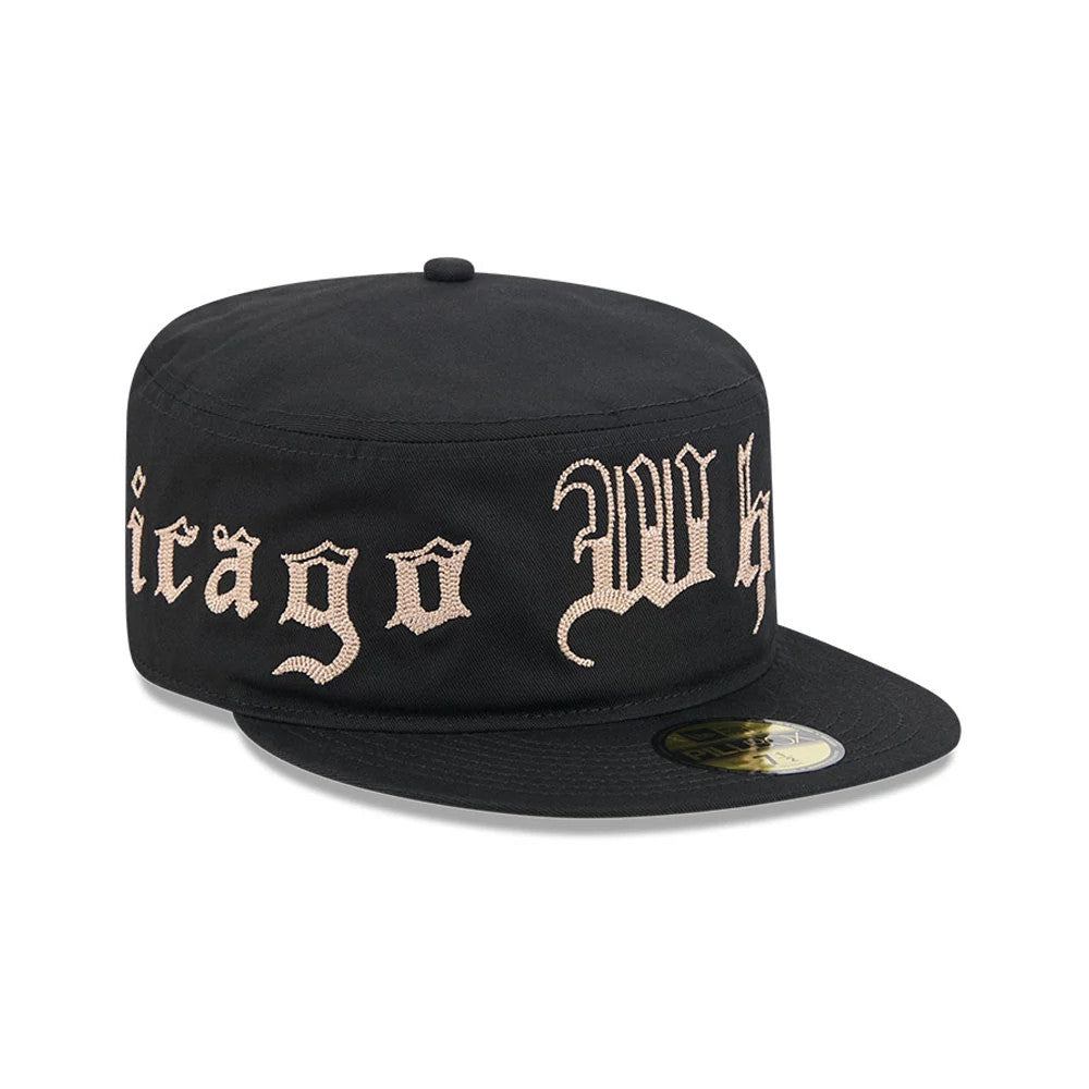 New Era Chicago White Sox MLB Heritage Black Pillbox Cap, front view showing cream embroidered Chicago White Sox script across the structured black crown, enhanced by a flat black visor with a gold 59FIFTY size sticker and a black top button.