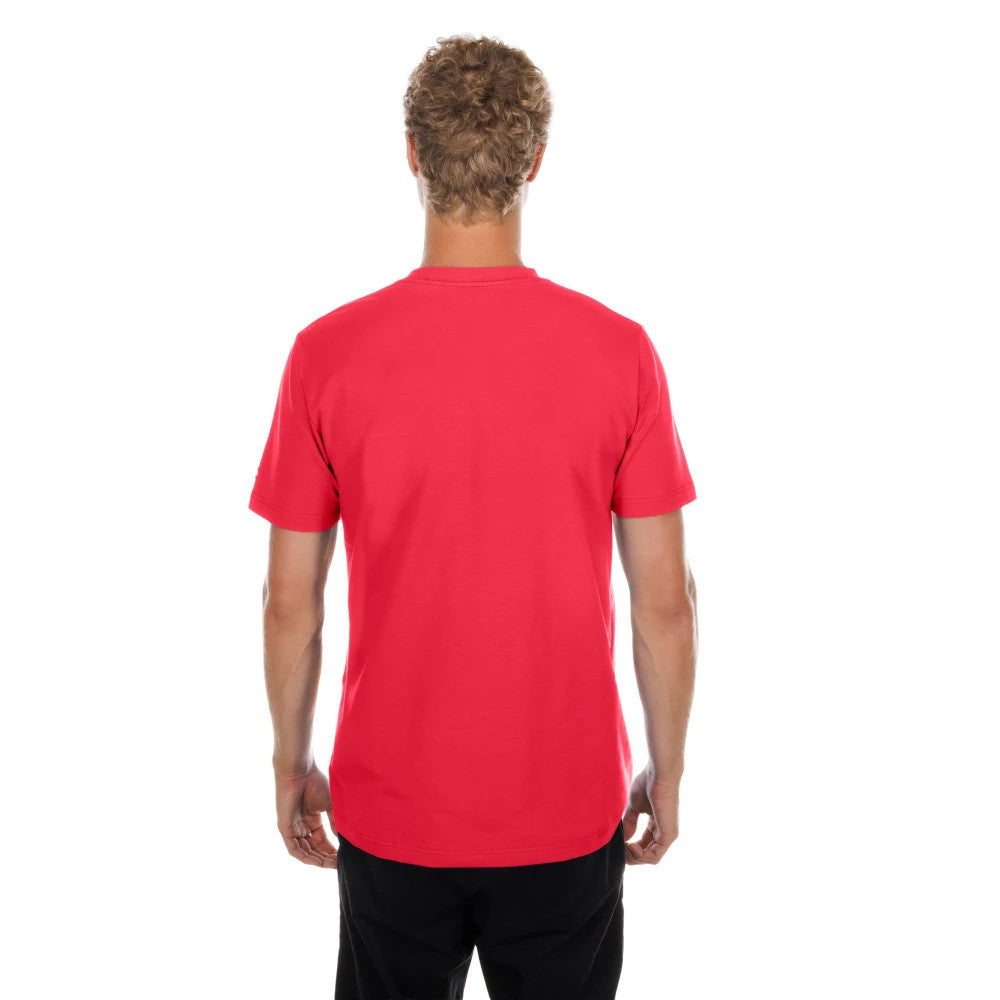 New Era San Francisco 49ers NFL Red T-Shirt, back view on a model showing the plain red fabric with a simple round neckline, short sleeves, and a seamless cut along the back, paired with casual black trousers.
