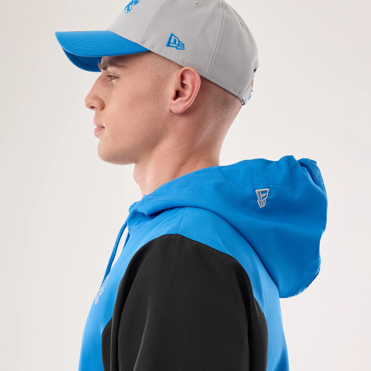 The model is wearing this NFL Detroit Lions Jacket in blue. 7