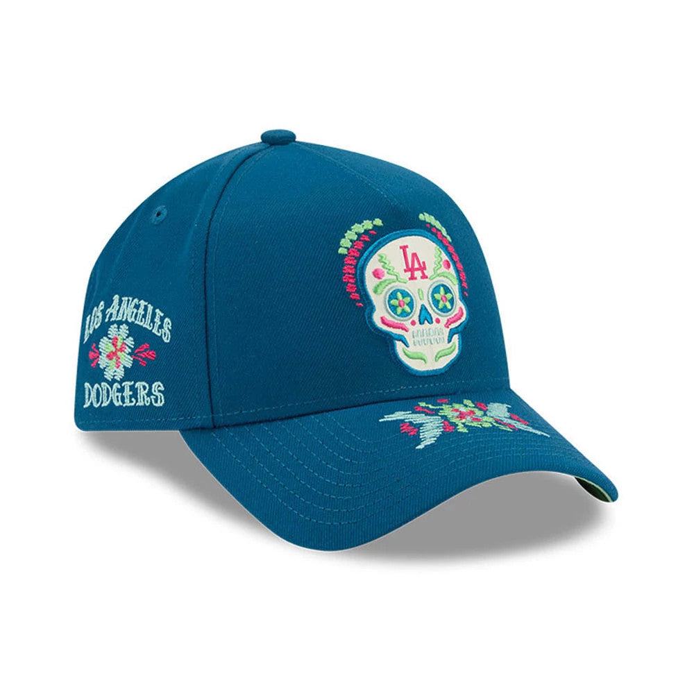 LA Dodgers MLB Day Of The Dead Blue New Era 9FORTY A-Frame Adjustable Cap, three-quarter view showing the colourful embroidered skull with LA initials on the front panel, floral embroidery on the visor and Los Angeles Dodgers text on the left side.