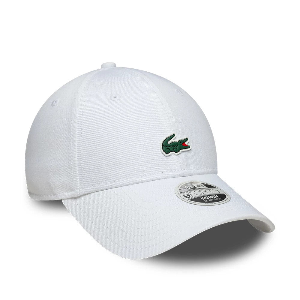Womens Lacoste X New Era White 9FORTY Adjustable Cap, three-quarter view showing the green embroidered Lacoste crocodile logo on the front panel, curved white visor, and 9FORTY size sticker.