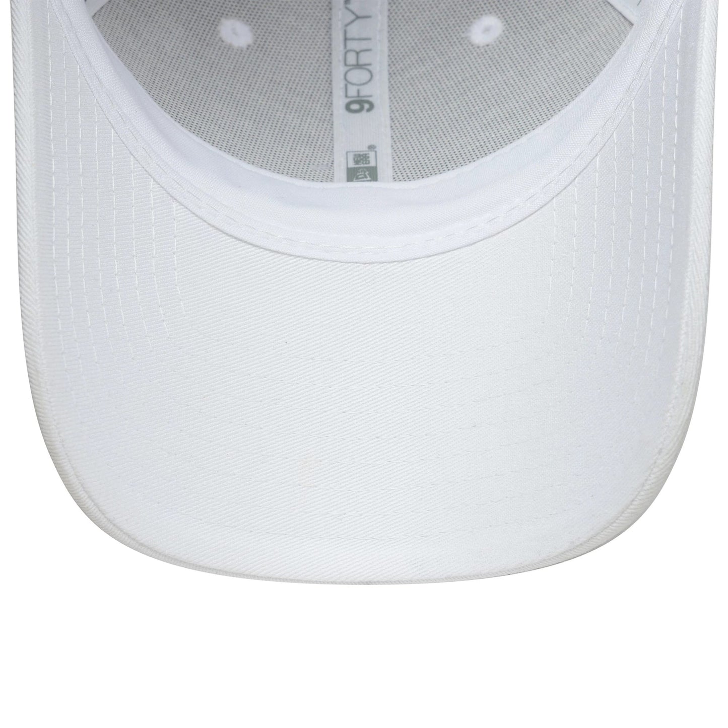Womens Lacoste X New Era White 9FORTY Adjustable Cap, inside view showing the white undervisor with stitching, the inner taping with a grey 9FORTY logo, and the mesh panel construction, highlighting its structured form.